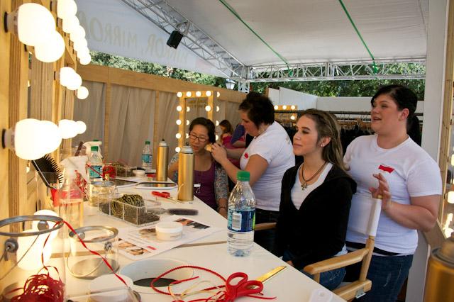 SMU students sit to get their hair and make-up styles  by professionals after being fitted for their Curve ID.