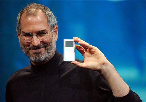 Steve Jobs displays the iPod mini in 2006. Jobs, the Apple founder and former CEO who invented and marketed gadgets that transformed everyday technology, died Wednesday. He was 56.