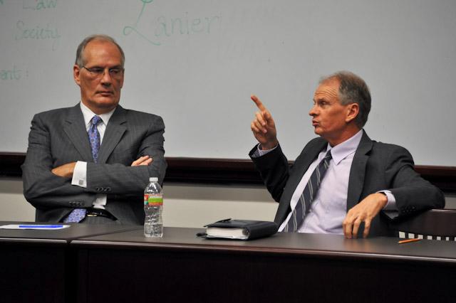 Dallas attorney Stephen F. Malouf and U.S. Ambassdor to Uganda Jerry Lanier discuss human rights and governmental concerns on the African continent during the Careers in International Diplomacy lecture on Thursday.