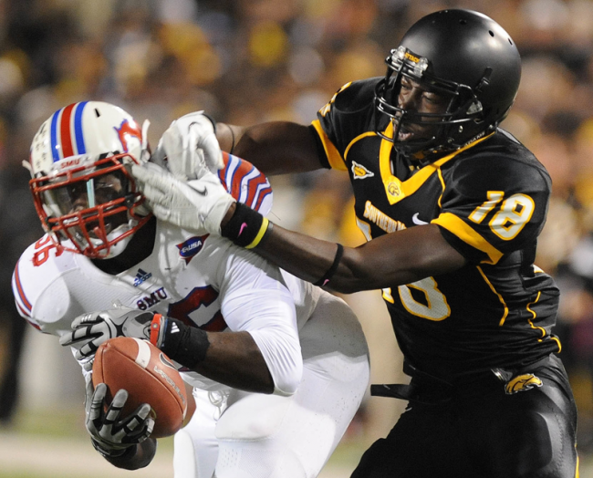SMU defender Ja’Gared Davis pulls in an interception on a pass intended for Southern Mississippi’s Brandon Francesconi during play Saturday evening.