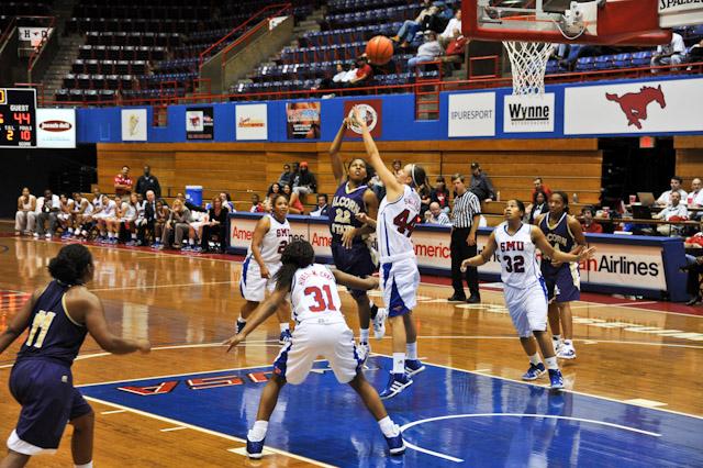 Sophomore post Mallory Singleton attempts to block a shot from Alcorn’s Kierro Frost. SMU defeated the Braves 76-54.