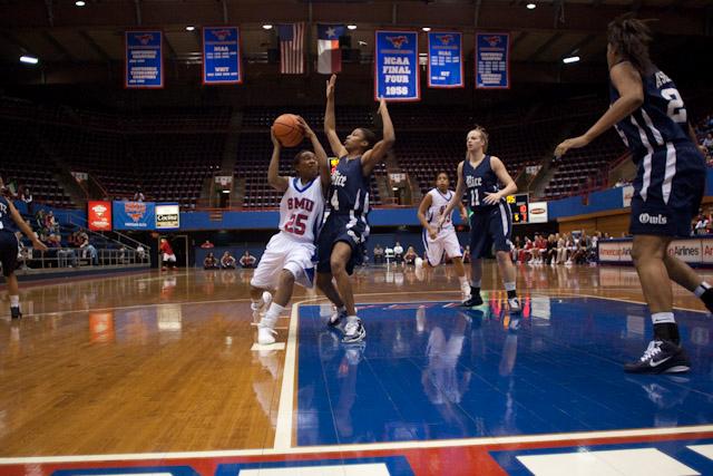 Sophomore guard Krystal Johnson attempts to make a pass during play against Rice March 3 in Moody Coliseum.