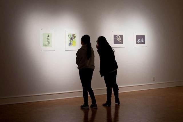 Students  explore the Unadorned exhibit in the Pollock Gallery