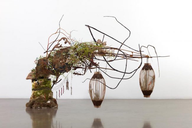 American artist Elliott Hundley uses a plethora of cosmetic and natural resources for his artwork.  Wood, fiberglass, bamboo, shells and even found lanterns compose these unique works. 