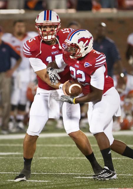 Running back Jared Williams takes a hand-off from J.J. McDermott.