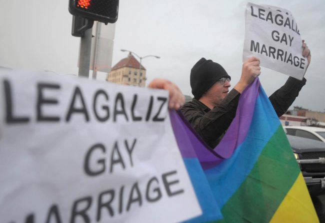 Jeff+Giard%2C+right%2C+holds+up+a+rainbow+flag+in+support+of+same-sex+marriage+in+Marysville%2C+Calif.+after+a+federal+appeals+court+declared+California%E2%80%99s+same-sex+marriage+ban+unconstitutional+on+Tuesday.+