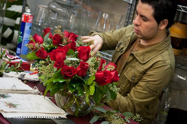 A florist arranges roses at Mockingbird Lane Florists in preperation for the Valentine’s Day rush.