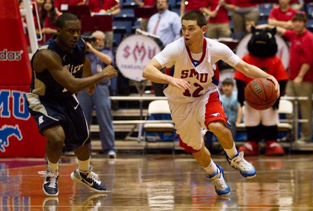 Sophomore guard Jeremiah Samarrippas runs the ball up court during a Spring 2011 season game against Rice University in Moody Coliseum.