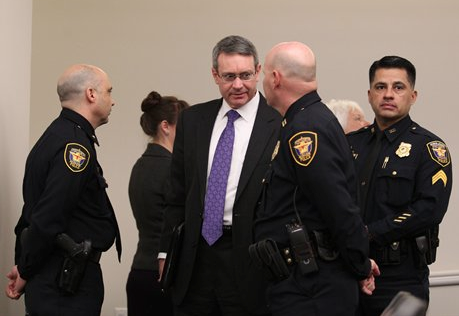 Texas Christian University Police Chief Steven McGee, center facing camera, and Fort Worth Police Capt. Ken Dean, right foreground, talk before a news conference Wednesday, Feb. 15, 2012 in Fort Worth, Texas. Police say four TCU football players are among 17 students who have been arrested in a campus drug bust. McGee said the students arrested Wednesday were caught in an undercover operation selling marijuana, cocaine, ecstasy and prescription drugs. 