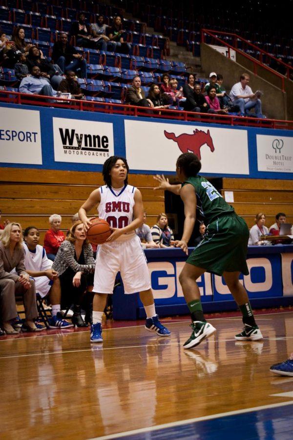 Junior guard Sabrina McKinney carries the ball down court during a game against Tulane Feb. 26.  at Moody Coliseum.