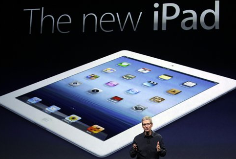 Apple CEO Tim Cook introduces the new iPad during an event in San Francisco, Wednesday. The new iPad features a sharper screen and a faster processor. Apple says the new display will be even sharper than the high-definition television set in the living room.