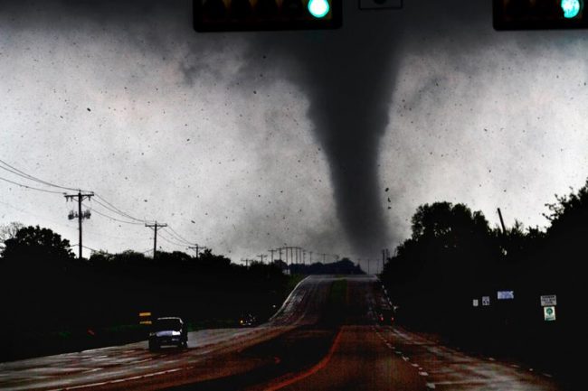 Tornadoes tore through the Dallas area Tuesday, peeling roofs off homes, tossing trucks into the air and leaving tractor trailers strewn along highways.