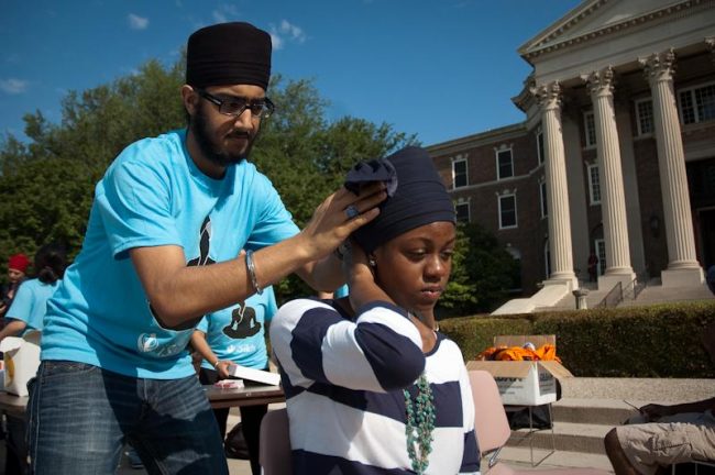 Members of the Sikh Student Association tied turbans around students heads in front of Dallas Hall Wednesday morning as part of their annual Sikh Turban Day. The event raises awareness of Sikh culture and history.