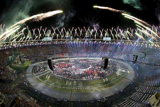 Fireworks explode over the stadium at the end of the Opening Ceremony of the 2012 Olympic Summer Games at the Olympic Stadium in London, Saturday, July 28, 2012.