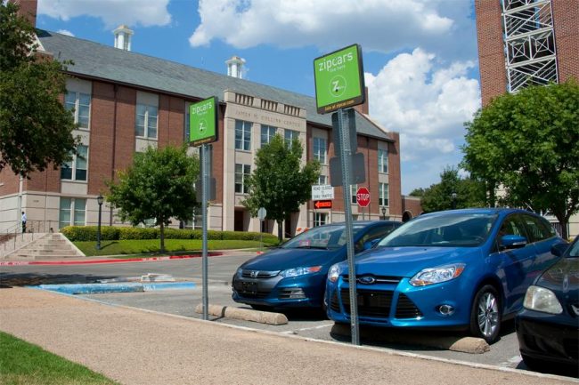 Two Zipcars parked outside of their permanent locations in Binkley Garage. 