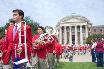 SMU Mustang Band leads SMU students, families, alumni and friends to the football game in traditional Mustang March.