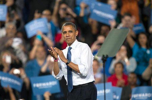 President Barack Obama applauds with the crowd after speaking at a campaign rally, Oct. 24, in Las Vegas. The president is on a two-day tour of key battleground states that included stops in Iowa and Colorado on Wednesday and was scheduled to head to Florida, Virginia and Ohio on Thursday