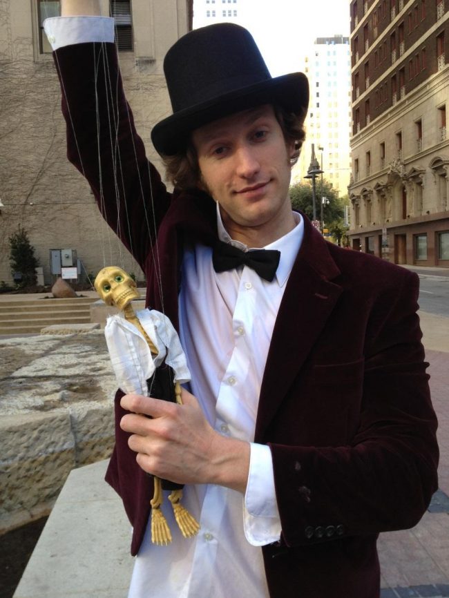 Puppeteer Will Schutze holding his main puppet – Mr. Bonetangles 