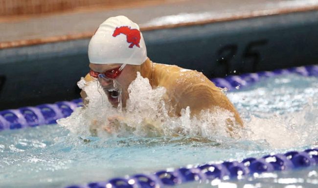 Devin Burnett swims during the NCAA Zone D swimming and diving competition on March 11 in Houston.