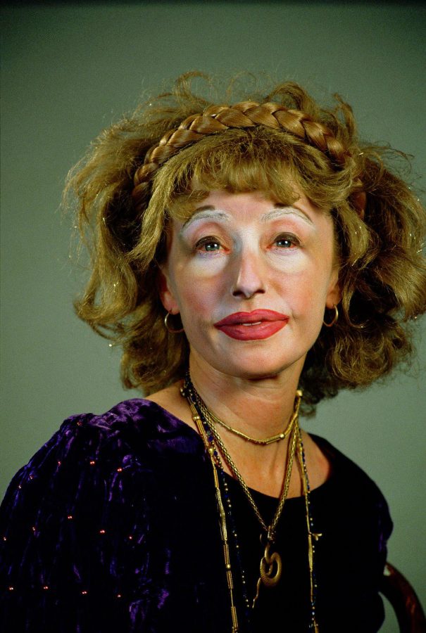 Cindy Sherman poses in costume in one of her famous self-portraits.