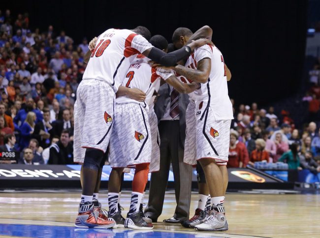 The Louisville  basketball team gathered around after witnessing Ware’s injury.