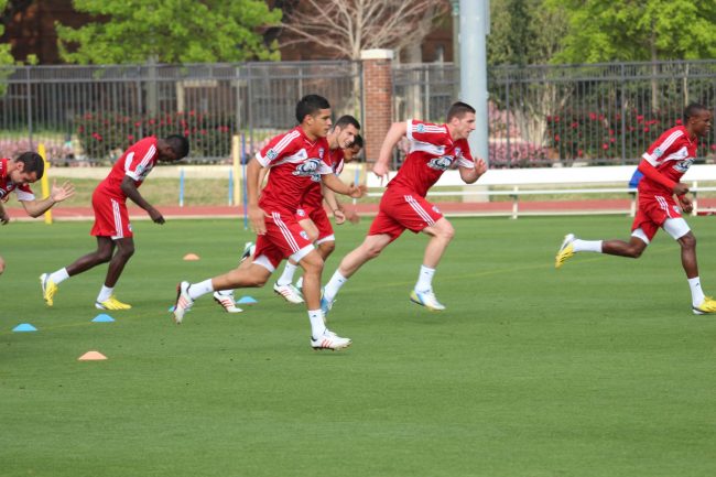 FC Dallas’ first team sprints across Westcott Field on SMU campus yesterday afternoon during warm ups for open practice day.