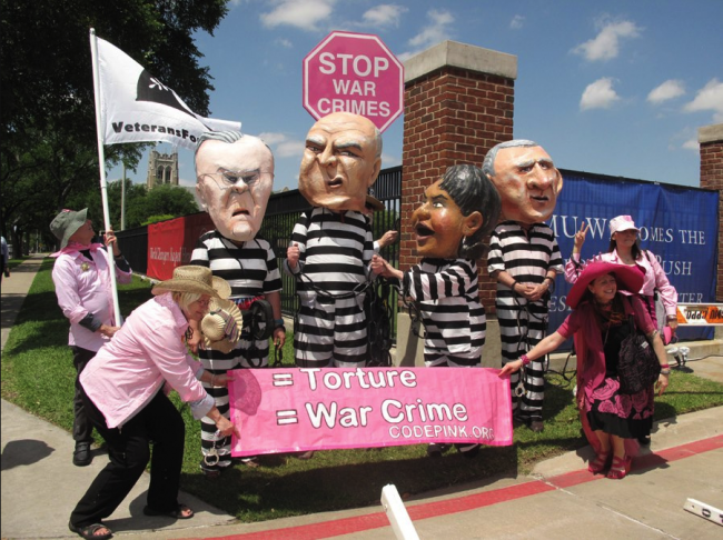 CODEPINK, a women-initiated grassroots peace and social justice movement, demonstrates on Mockingbird Lane beside SMU campus Monday.