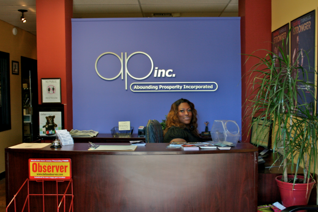  Pocahontas Duvall, a member of Abounding Prosperitys outreach team, sits and works at the front desk.