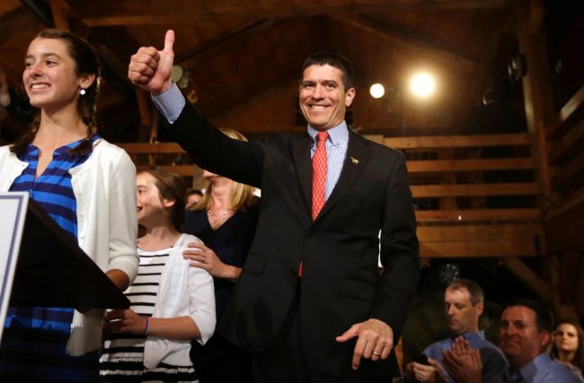 Gabriel Gomez, Republican candidate for the U.S. Senate, center, gives a thumbs up while standing on the stage next to his daughter  Olivia, before a victory speech at a watch party, in Cohasset, Mass., Tuesday, April 30, 2013.