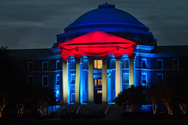 Dallas Hall was lit up SMU red and blue for the Centennial Celebration in 2011. SMU is now offering classes online. Sidney Holllingsworth/The Daily Campus