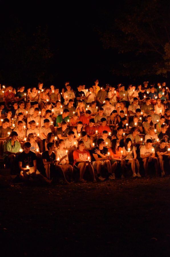 Entering students participate in the candlelight ceremony at the closing of Mustang Coral in 2011.