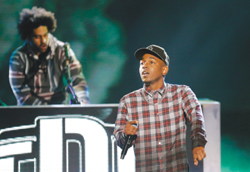 Rapper Kendrick Lamar, right, performs at the BET Hip Hop Awards, Saturday, Sept. 28, 2013, in Atlanta. (AP Photo/David Goldman)