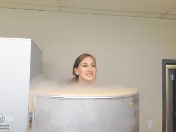 Woman undergoes cryosauna session to relieve soreness and fatigue. (Courtesy of Kelly Phipps)