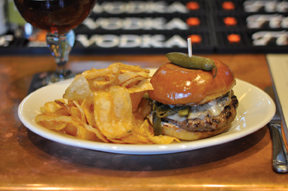 The Rustic serves up a heap of meat in the form of a large beef burger with green chilies, cheddar and more — remind the waiter to top it with brisket.Photo credit: W. Tucker Keene.