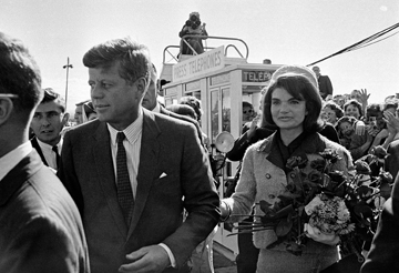 FILE - In this Nov. 22, 1963 file photo, President John F. Kennedy and his wife, Jacqueline Kennedy, arrive at Love Field airport in Dallas. (AP Photo/File)