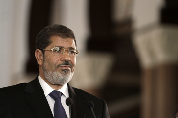 In this Friday, July 13, 2012 photo, Egyptian President Mohammed Morsi holds a joint news conference with Tunisian President Moncef Marzouki, unseen, at the Presidential palace in Cairo, Egypt. Egypts Islamist president may look like hes running out of options as he faces an appeals court strike and massive opposition protests over decrees granting himself near absolute power. Will he back down now? Most likely not. Mohammed Morsis next move may be to raise the stakes even higher. Signs are growing the constitutional panel at the heart of the showdown could vote on a draft this week despite a walkout by liberal and Christian members. (AP Photo/Maya Alleruzzo)