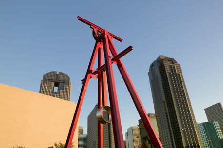 Mark Di Suveros Proverb is the pendulum sculpture that sits outside the Dallas Symphony.