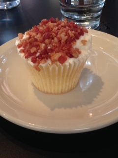 Bacon-topped cupcake form Kreme de la Cupcake. Photo credit: Paige Kerley