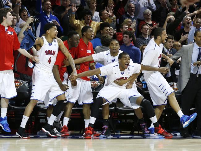 The SMU bench, including guard Keith Frazier (4), guard Sterling Brown (3) and center Cannen Cunningham (15), celebrates just before time expired in the quarterfinals of the NIT.  (Courtesy of AP)