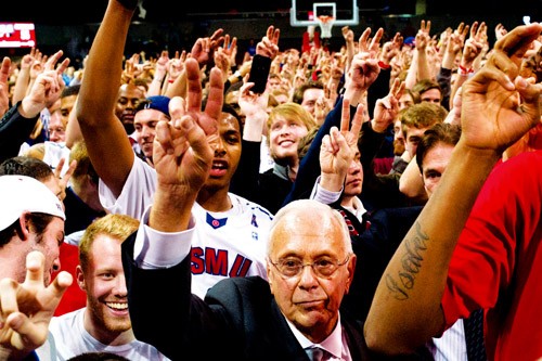 DALLAS, TX - FEBRUARY 8:  Head coach Larry Brown of the SMU Mustangs celebrates with fans after defeating the Cincinnati Bearcats on February 8, 2014 at Moody Coliseum in Dallas, Texas.  (Photo by Cooper Neill/Getty Images)