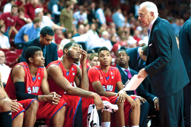 SMUs Head coach Larry Brown talking to his players during a time out