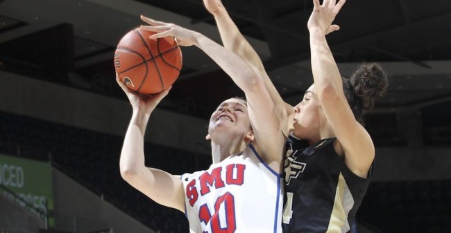 SMU Mustangs forward Alicia Froling #10 drives for a layup and is fouled by UCF Knights forward Fifi Ndour #24 at Moody Coliseum.  Photo by Vladimir Cherry.