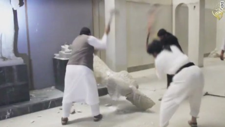 ISIS militant destroys ancient artwork in Iraq