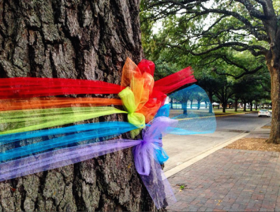 Trees along the boulevard decorated for National Coming Out Day.