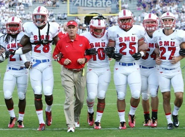 Coach Morris and SMU players locking arms during the new pregame tradition Photo credit: SMU Athletics