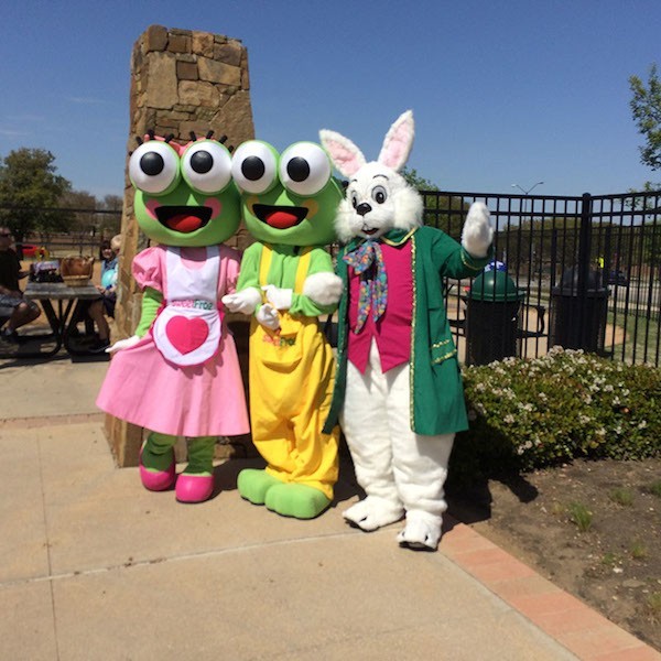 Julio poses with Sweet Frog mascots before the first egg hunt. Photo credit: Jacquelyn Elias