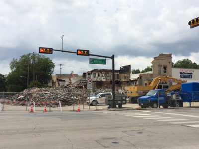 Bulldozers and firefighters worked throughout the night to break down walls and put out the fire. Photo credit: Jacquelyn Elias