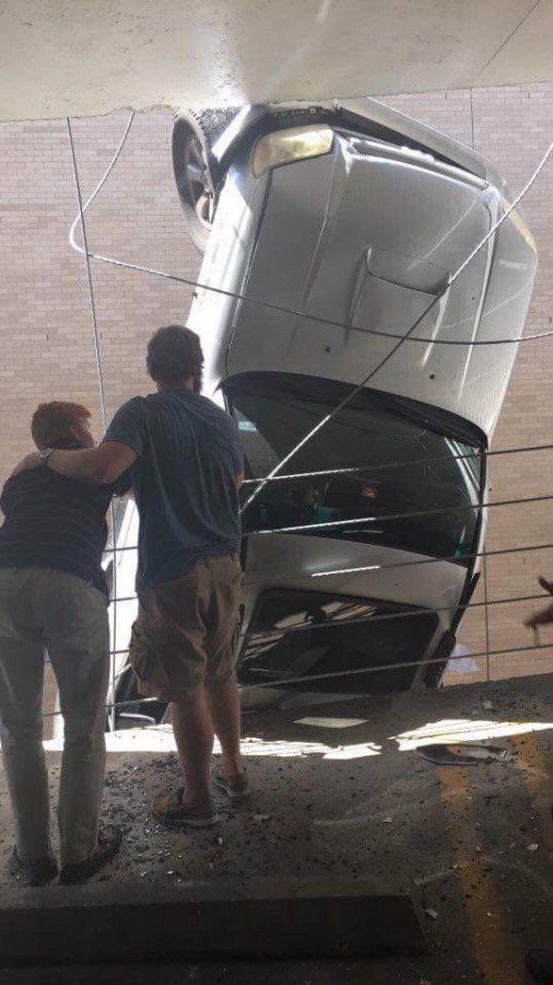 OConnors car suspended in the air on the side of the parking garage. Photo credit: William OConnor