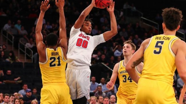 Ben Moore (00) looks to pass as Zak Irvin defends on Friday at Madison Square Garden. (Photo Credit: SMU Athletics).
