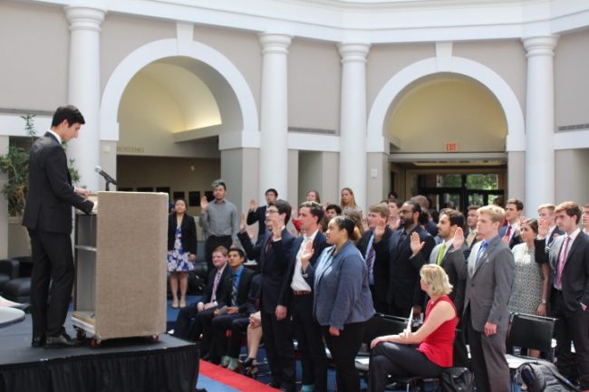 New Student Body President David Shirzad swearing in the 104th Student Senate senators, officers, and chairs.